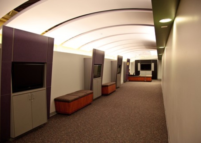 interior study space with seating and TV monitors