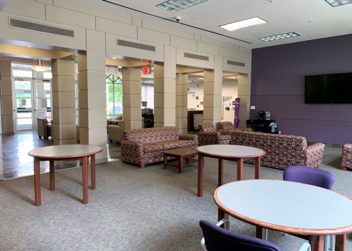 three tables with chairs and couches