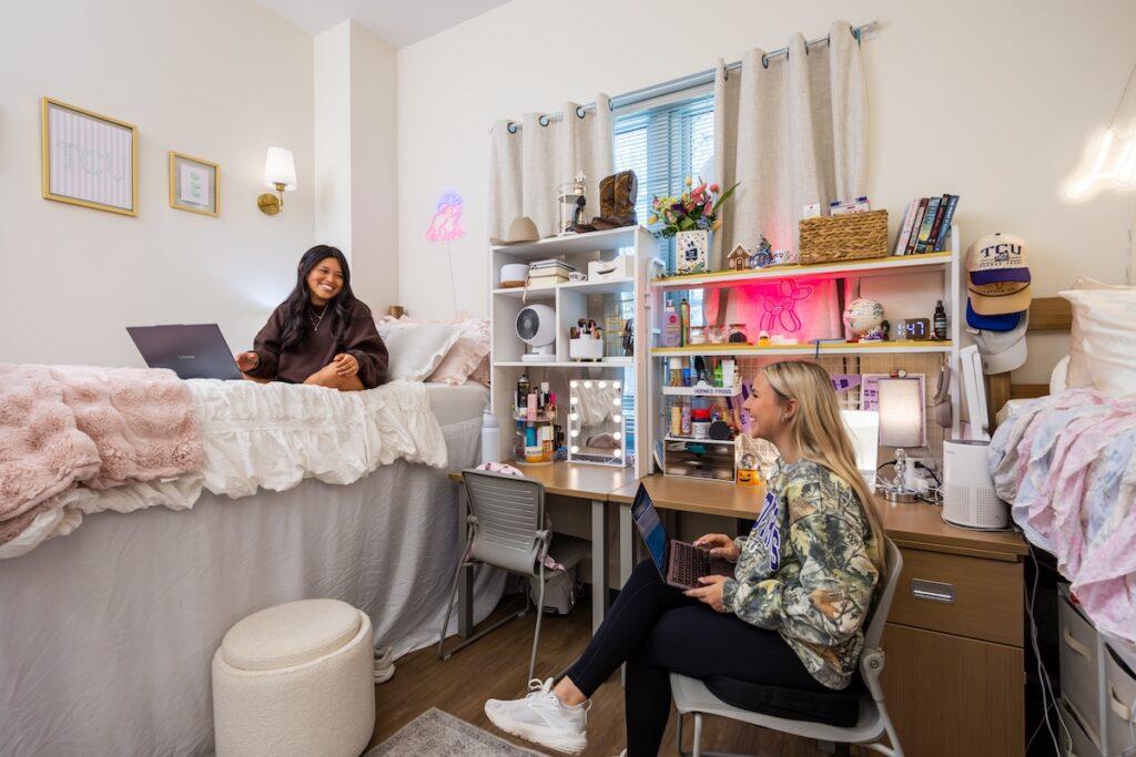 Two students talk in their room in Walsh Hall, October 23, 2025. Photo by James Anger.